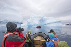 Zodiac cruising among icebergs in Antarctica photo by Cheesemans’ Ecology Safaris