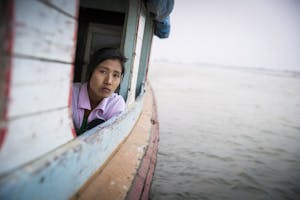 Woman on river in Myanmar photo by Scott Davis