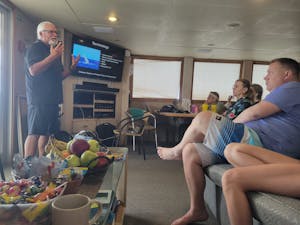 Travelers in Briefing © Adam Walter